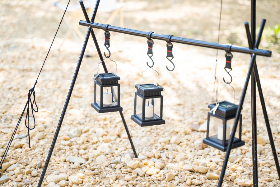 Three solar lanterns hanged at campsite