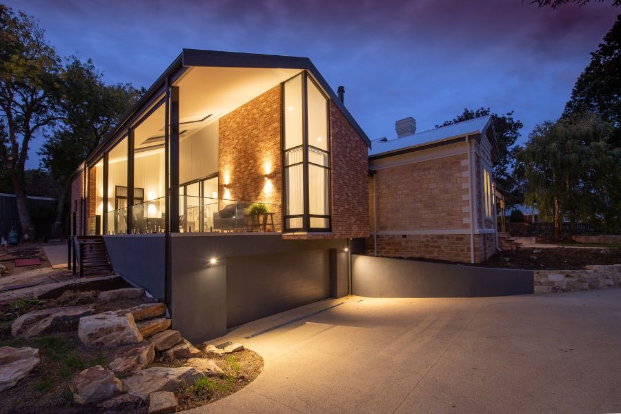 Modern house with light on at dusk