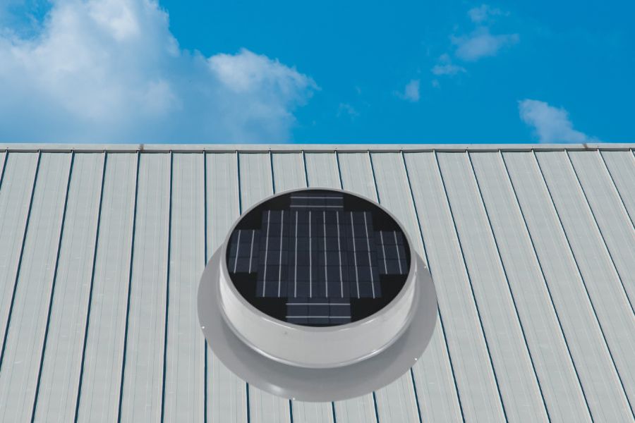 A solar attic fan installed on house roof