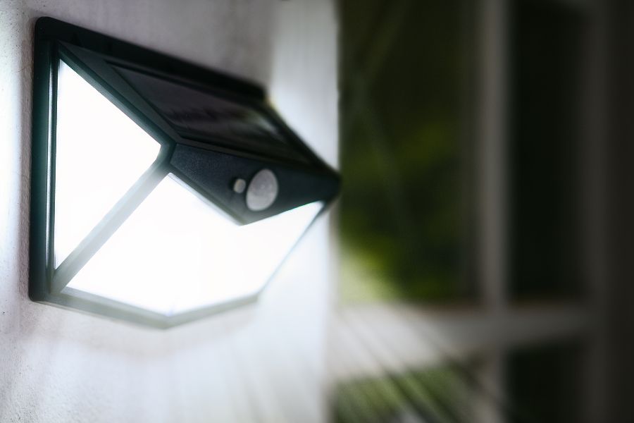 Solar powered LED light mounted on wall